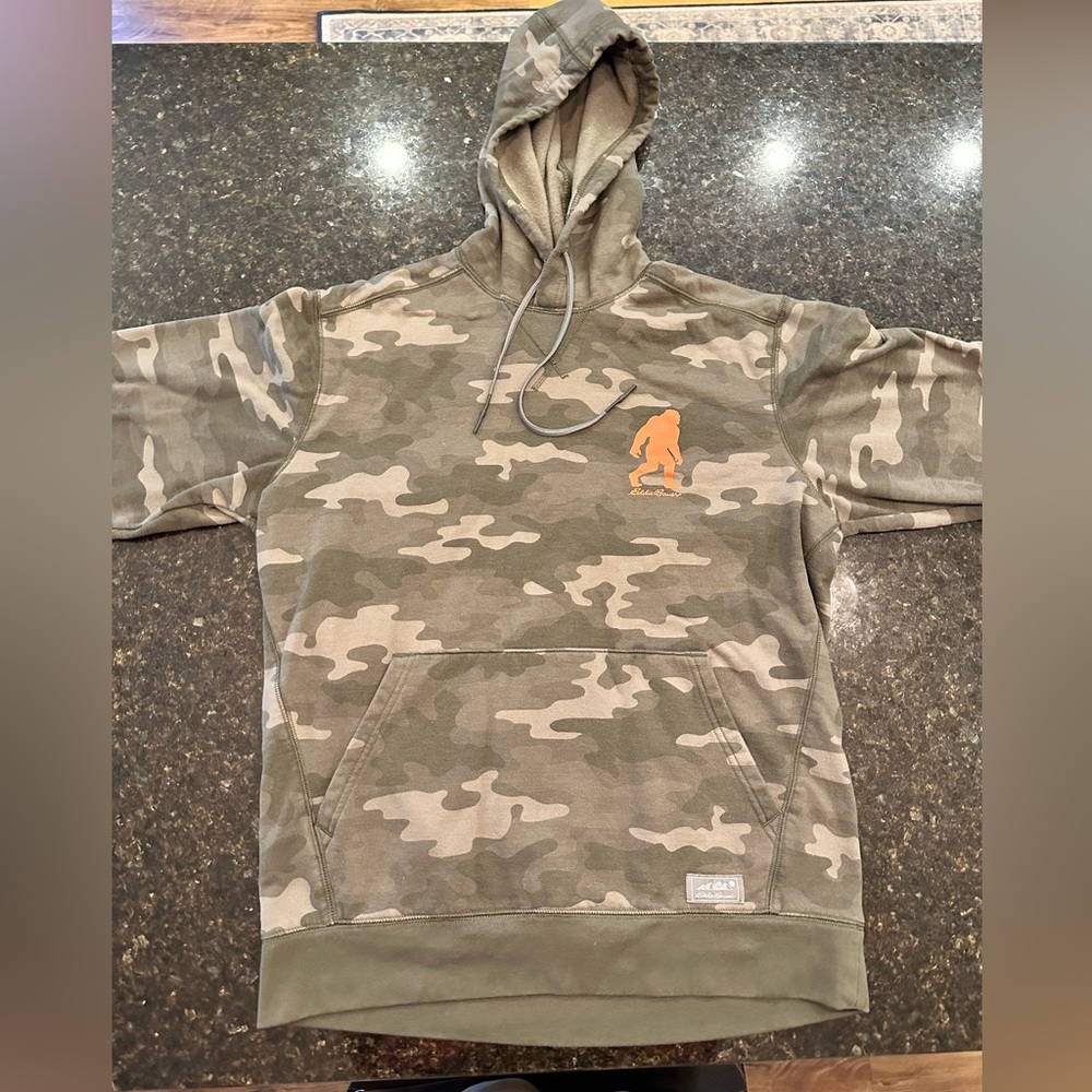 Eddie Bauer Men’s Medium camo pullover hoodie with Sasquatch logo